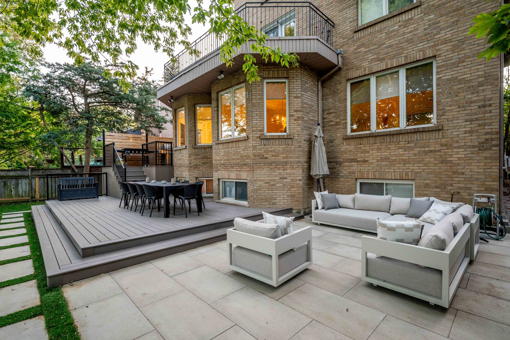 Hardscape Seating area with lower deck area and patio furniture