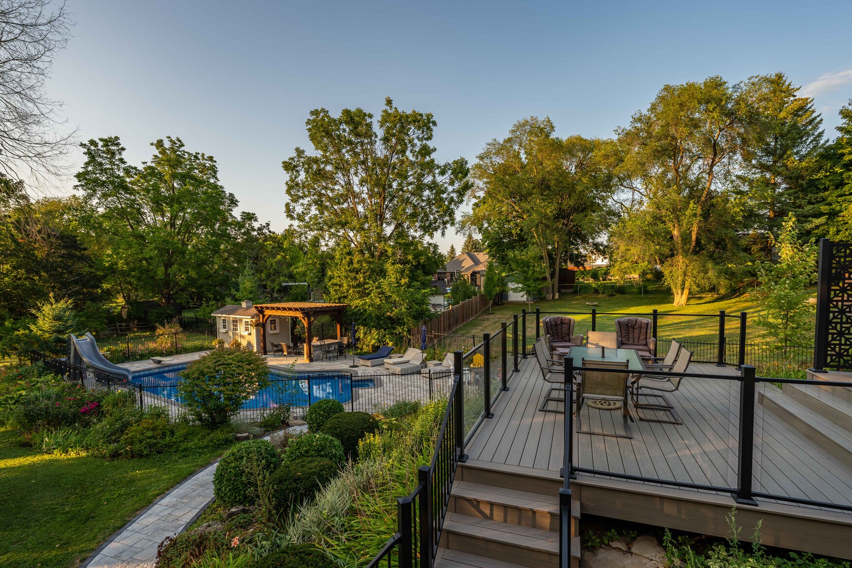Deck overviewing pool hardscape project with pathway