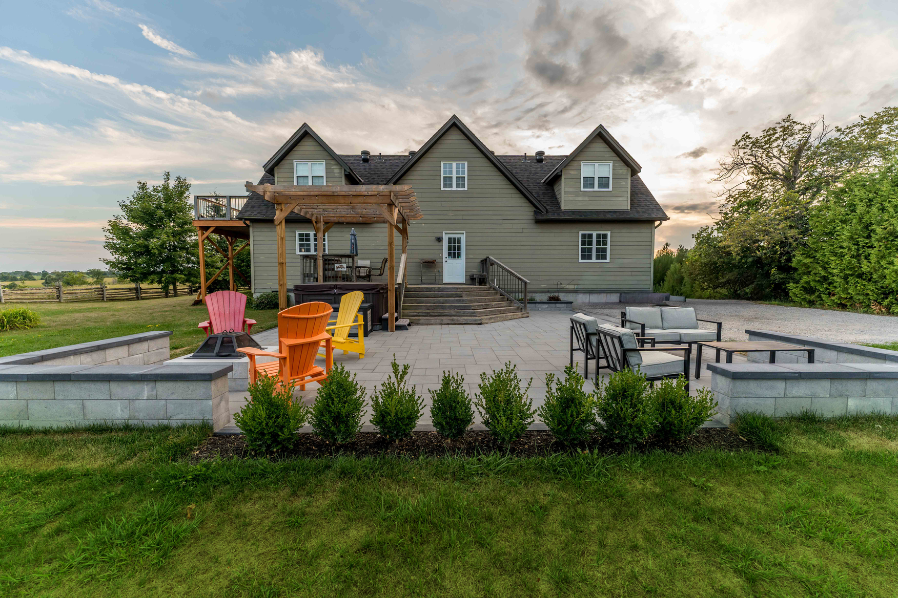 Completed backyard hardscape patio with pergola in Innisfil, Ontario