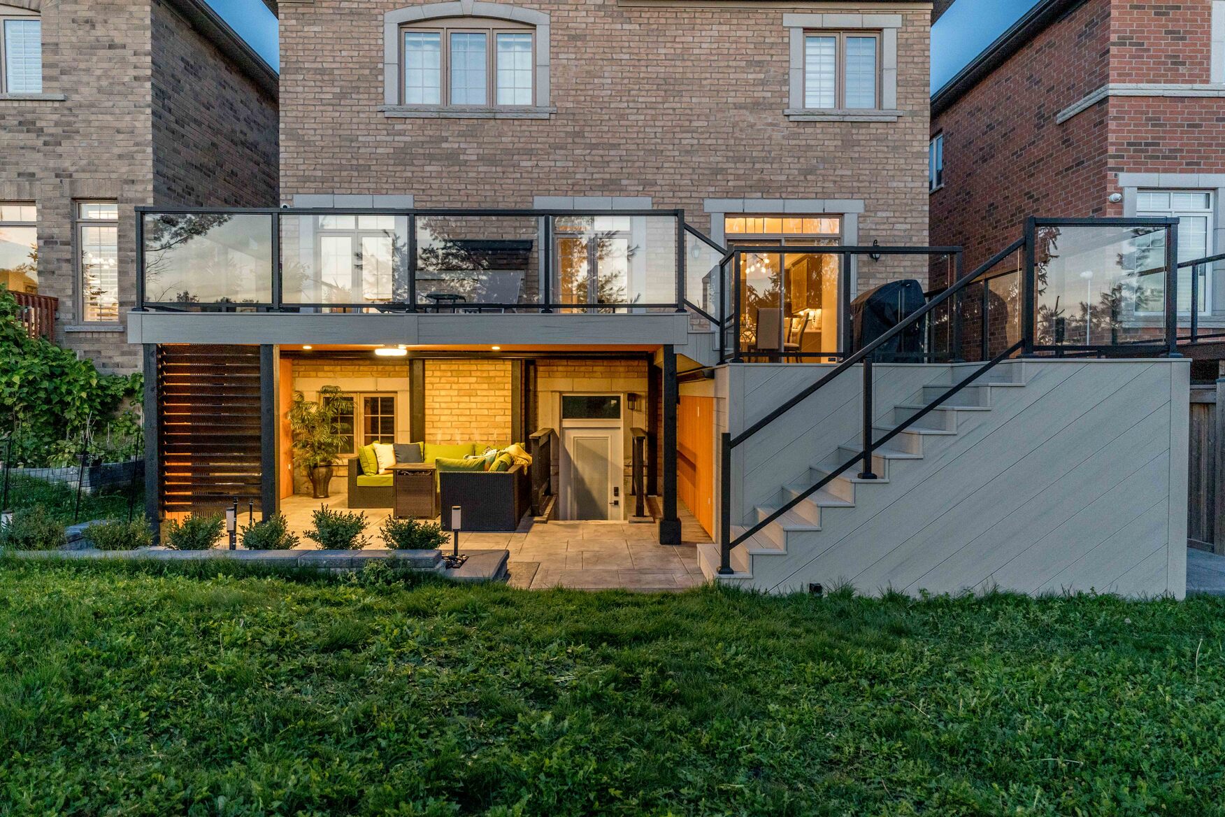 Two tier composite deck in bradford with covered outdoor living space underneath